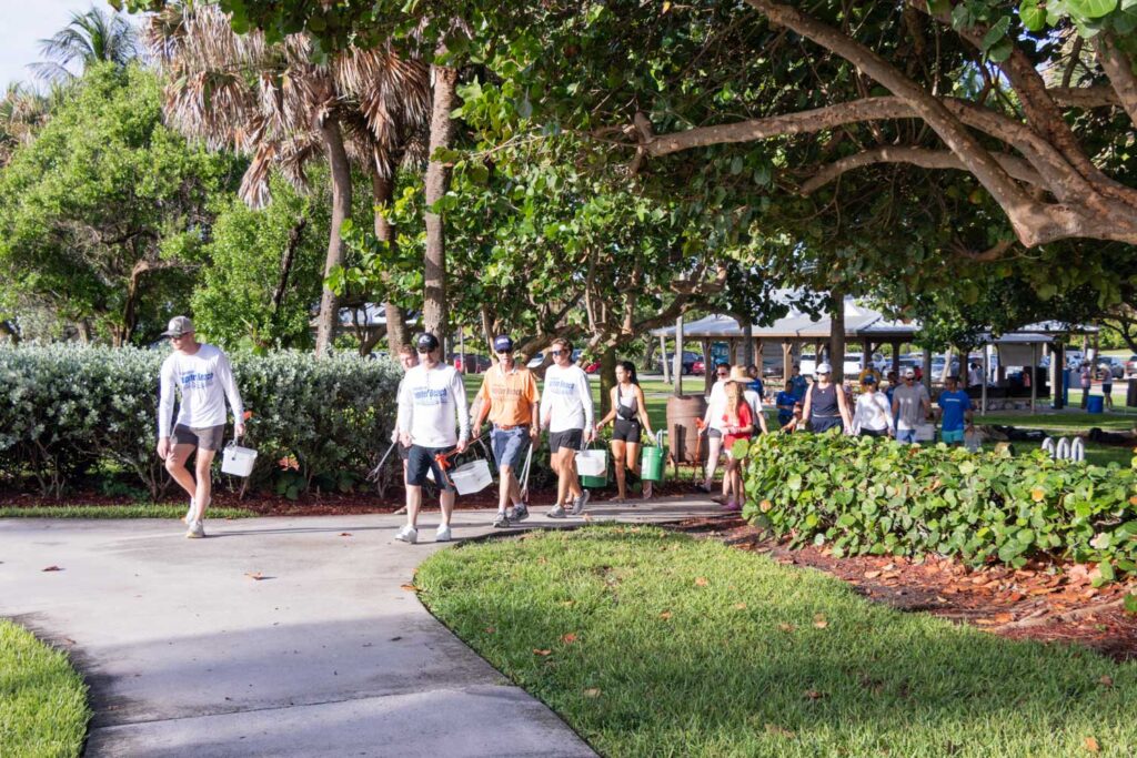 Volunteers walking through the park toward the beach access.