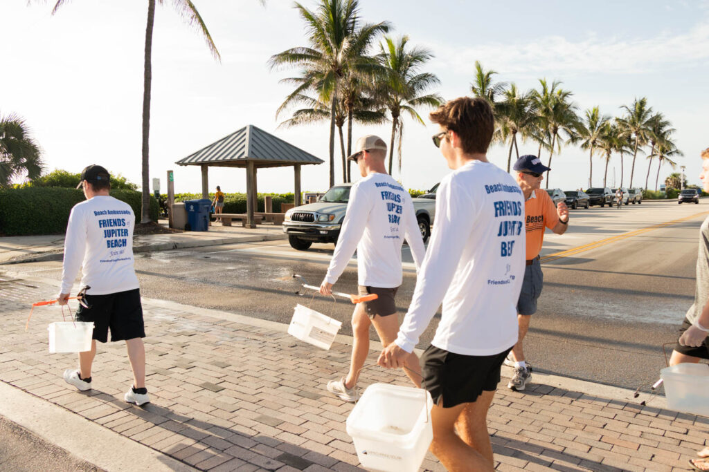 Volunteers walking through the park toward the beach access.