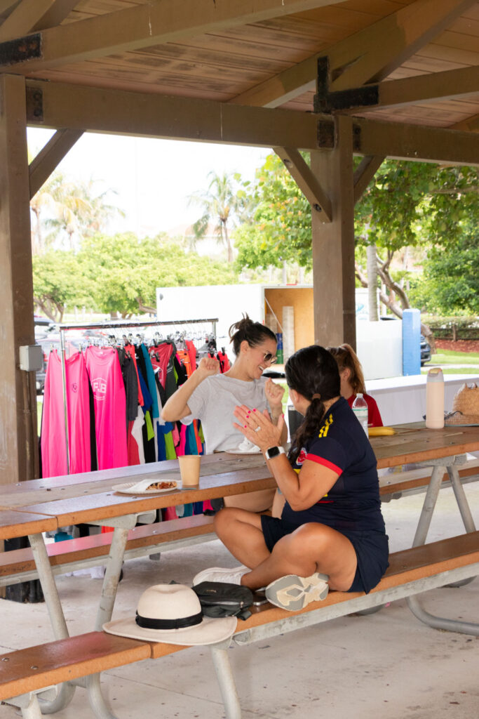 Volunteers seated at a picnic table during the event.
