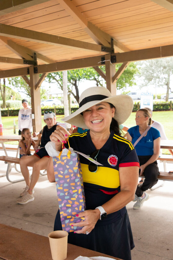 Participant holding a gift bag during the post-cleanup event.