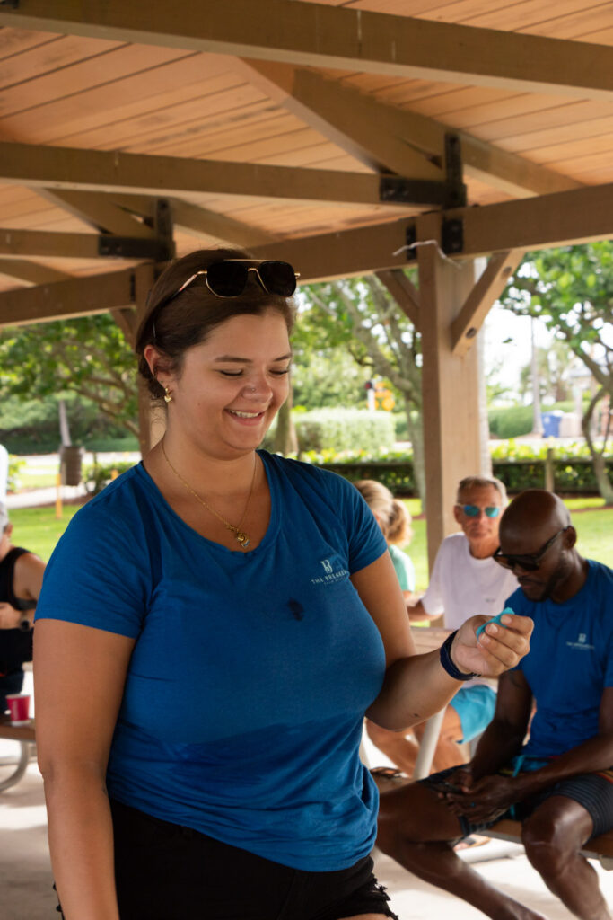 Participant holding a raffle ticket during the post-cleanup event.