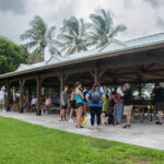 Volunteers standing under Anita Lankler Pavilion.