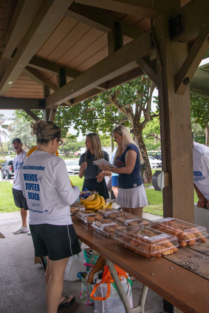 Volunteers arranging food to distribute.