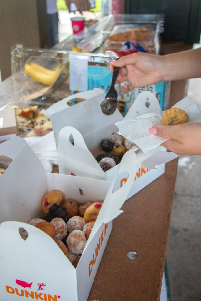 Dunkin donuts munchkins being served.