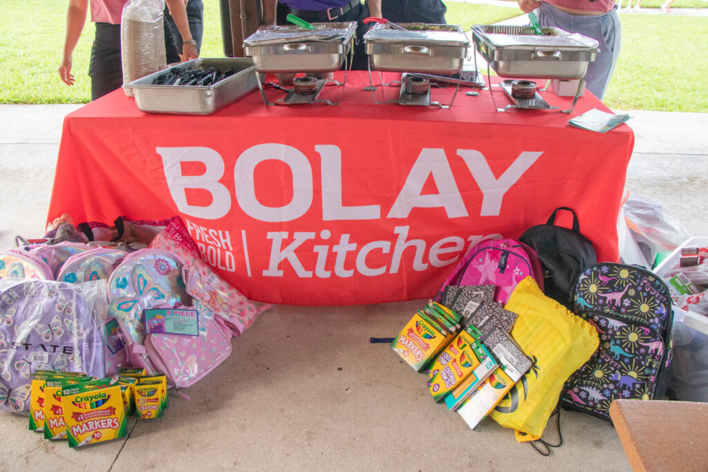Bolay table with donated school supplies.