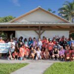 Large group of volunteers standing in front of Anita Lankler Pavilion in Jupiter.