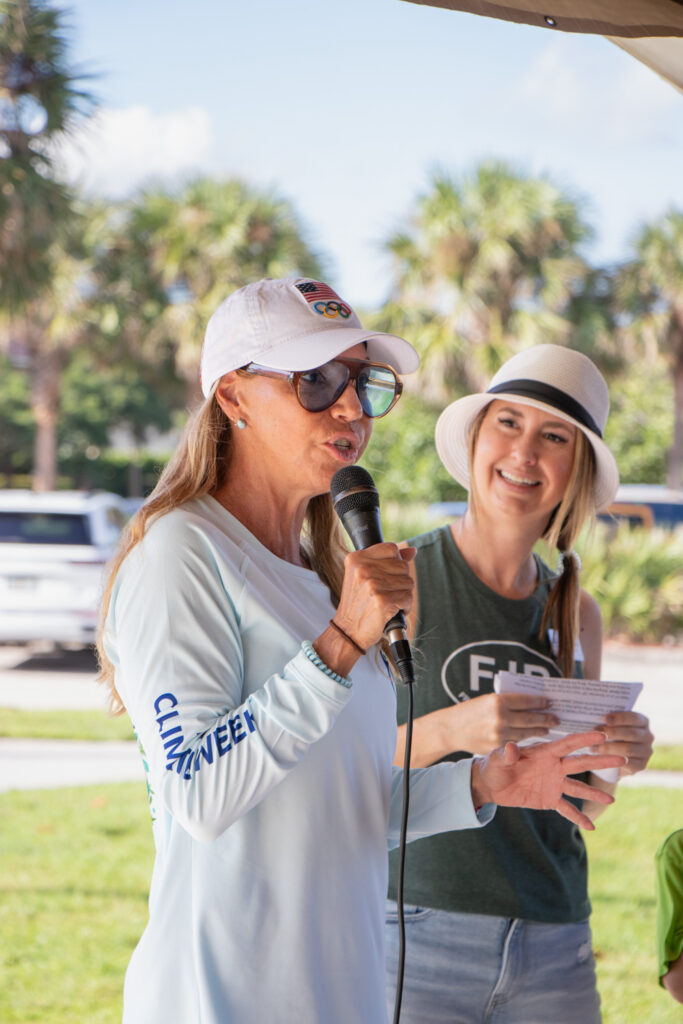 Friends of Jupiter Beach volunteer speaking on the microphone.