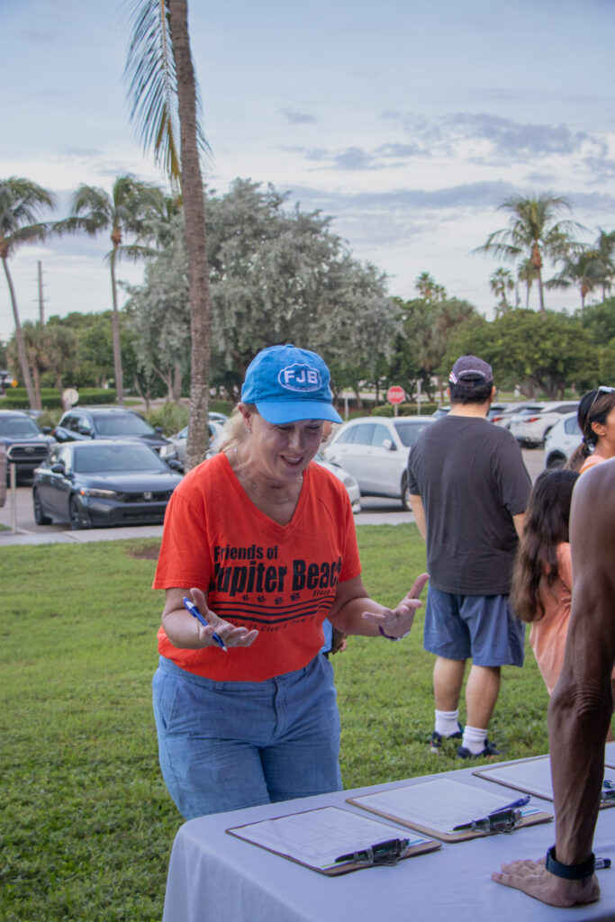 Volunteer signing in for beach cleanup.